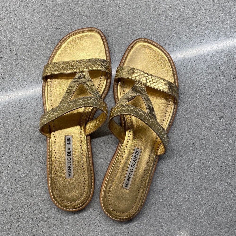 Manolo Blahnik flat gold sandals.